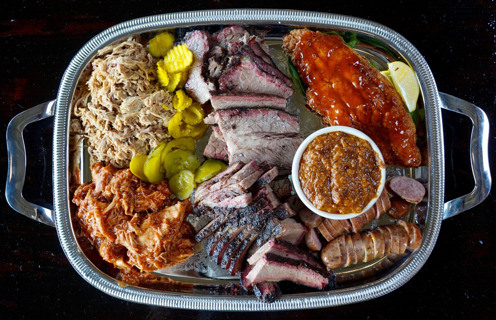 Buxton Hall Barbecue catering tray with brisket, pulled pork, and sausage